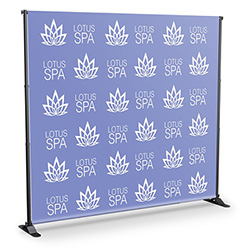 Step and repeat banner stand with fabric banner and adjustable tube frame.