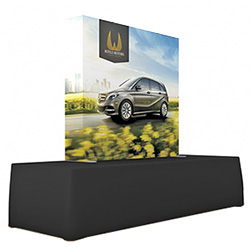 Pop-up tension fabric display on table with black table cover